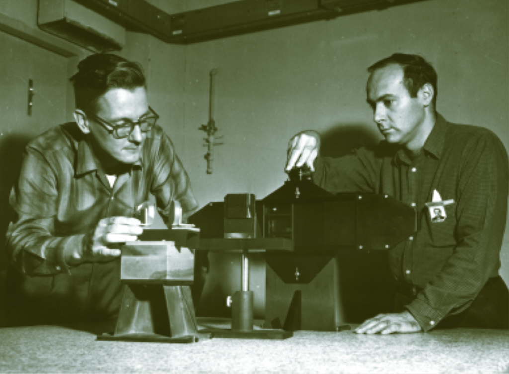 Holography pioneers Emmett Leith right and Juris Upatnieks at the Radar Optics Lab Willow Run Laboratories 1964. Bentley Historical Library University of Michigan.